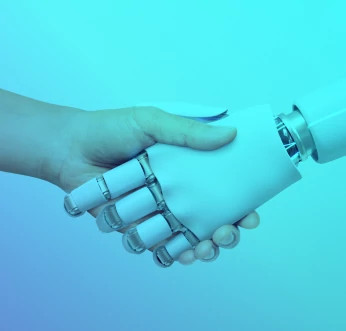 A robotic hand shaking a human hand